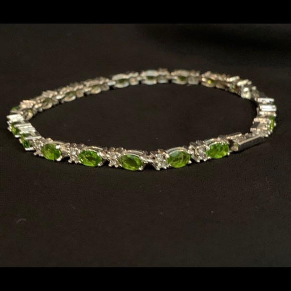 Avon Jewelry - tennis bracelet in green and silver.